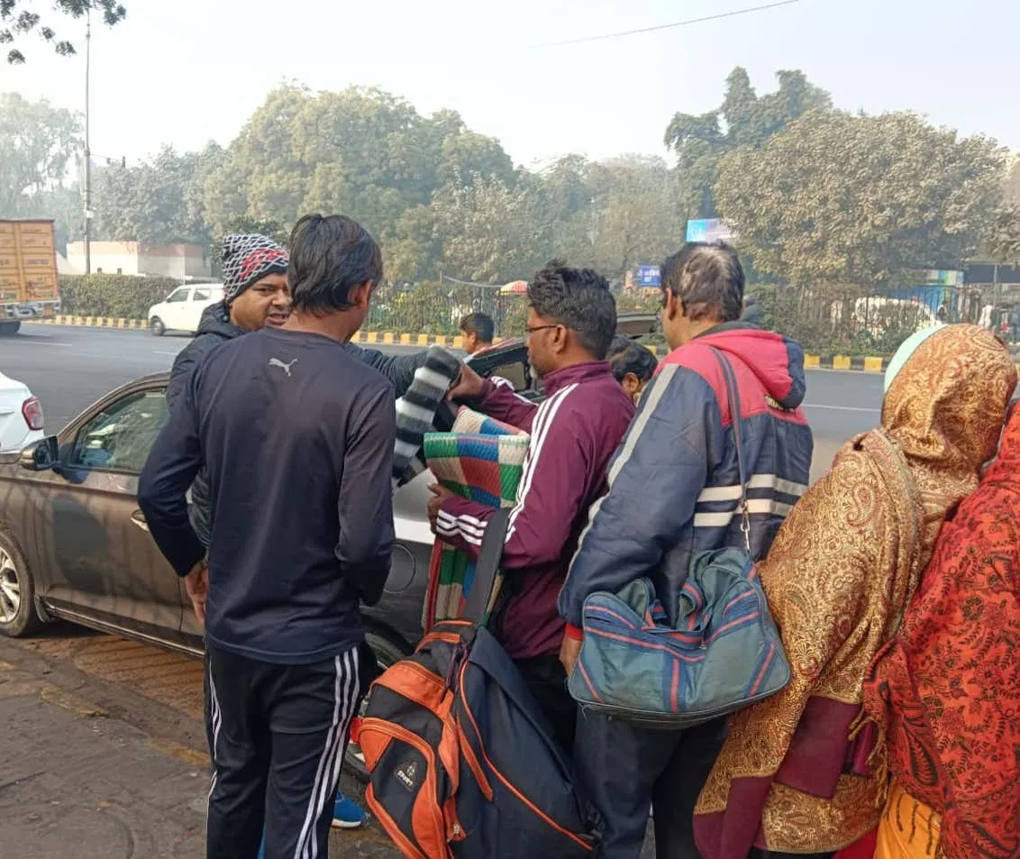 Handing out blankets on a chilly morning