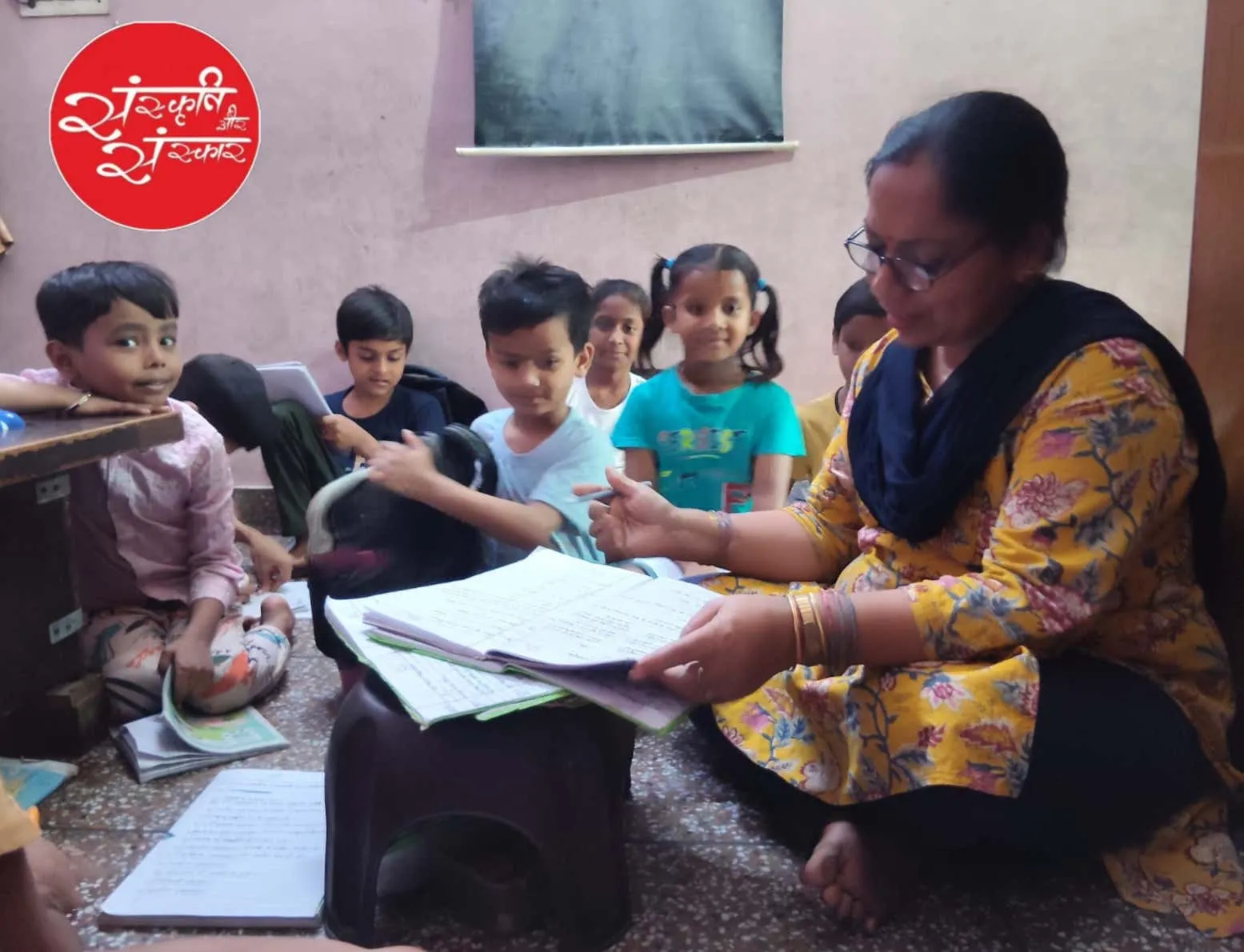 A teacher guiding young learners through their lessons