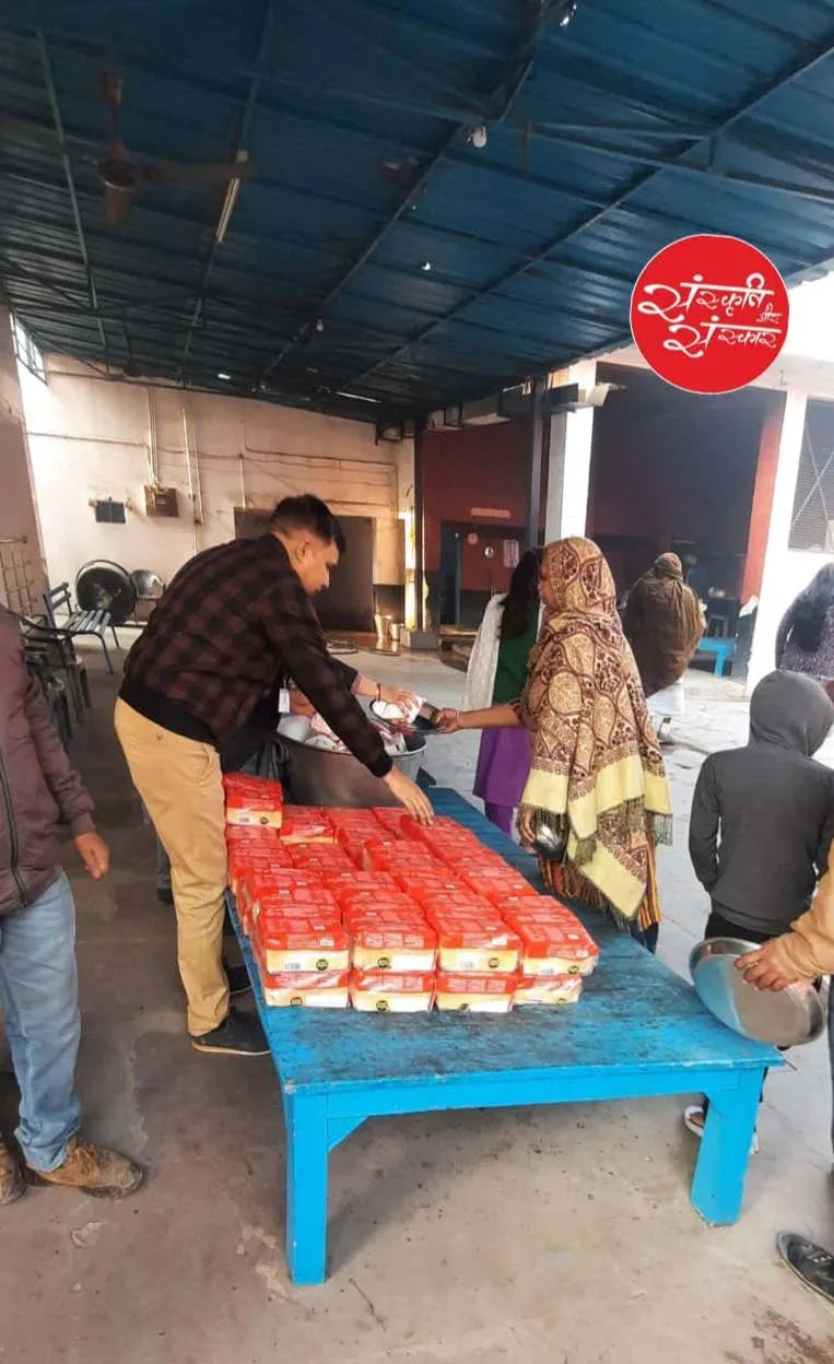 Serving food at the ashram courtyard