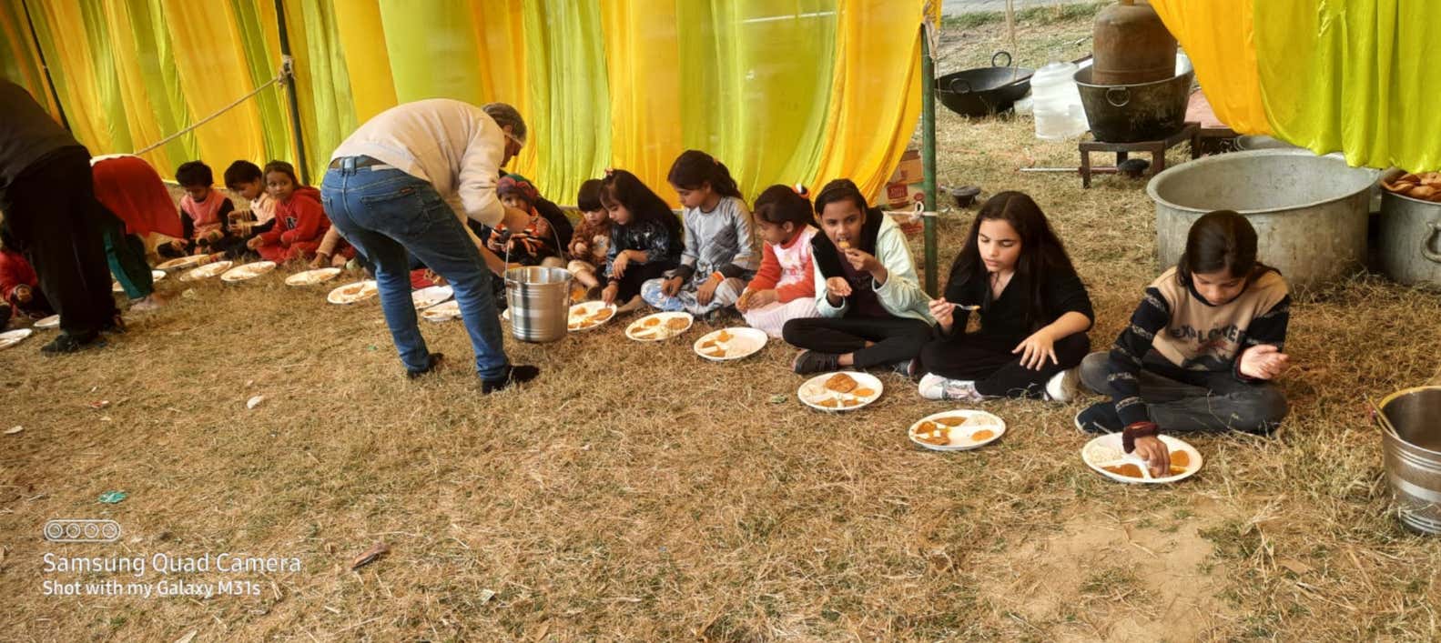 Children sharing a community meal