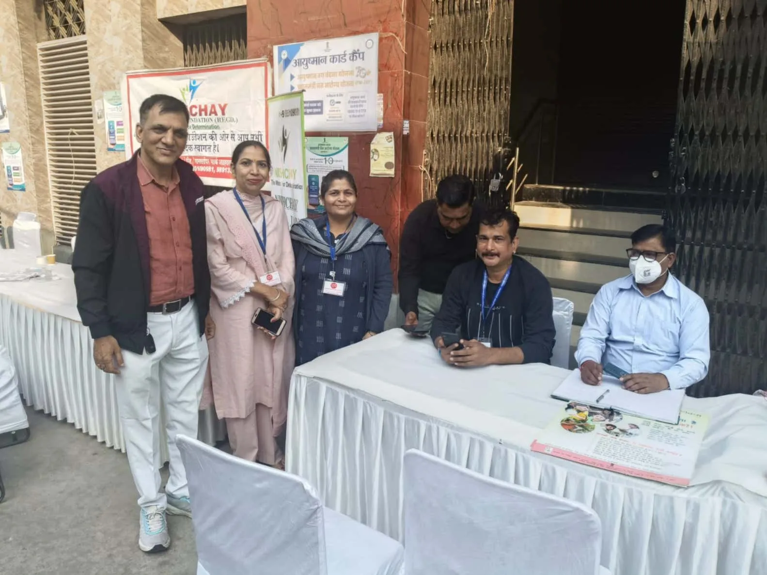 Foundation team welcoming visitors at the camp